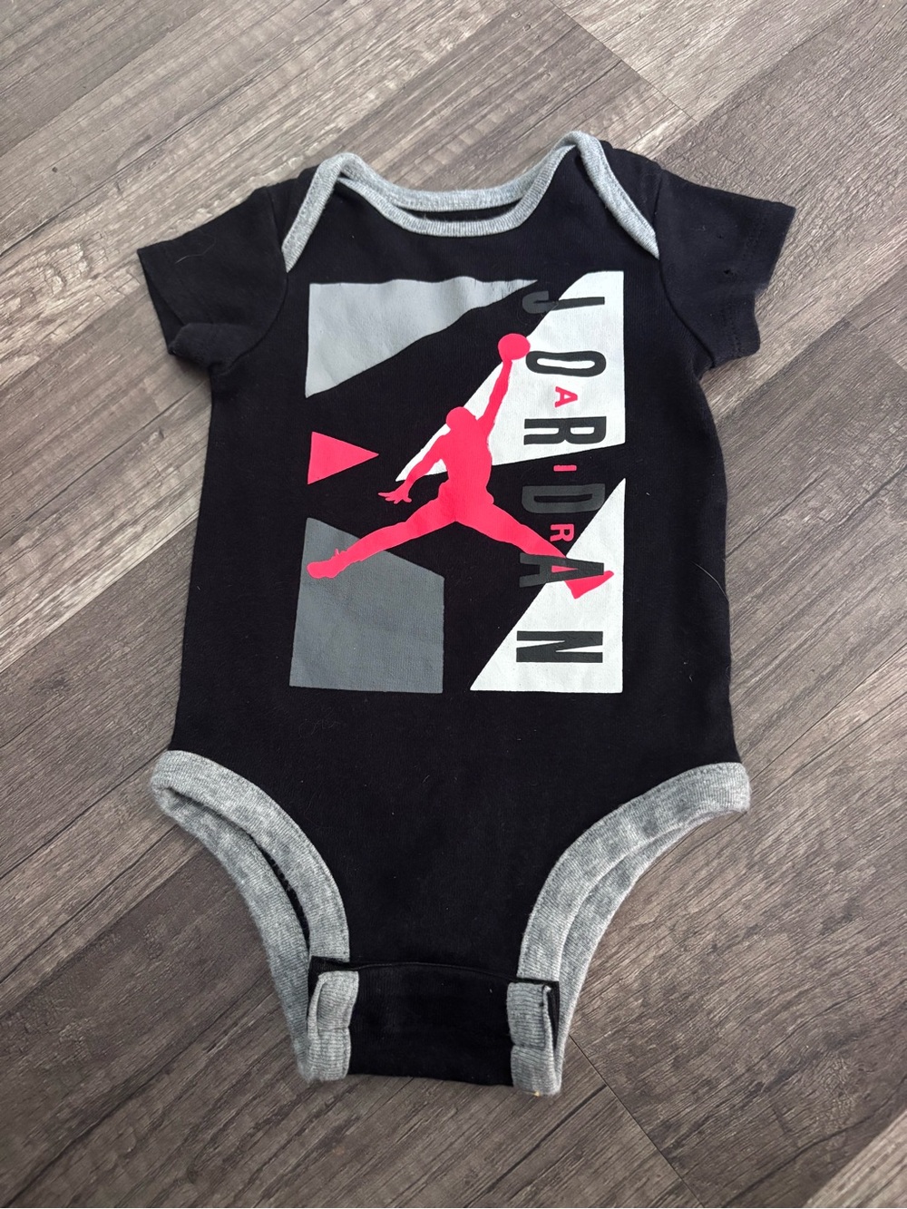 Jordan Black One-Piece with Gray Trim and Pink Jumpman